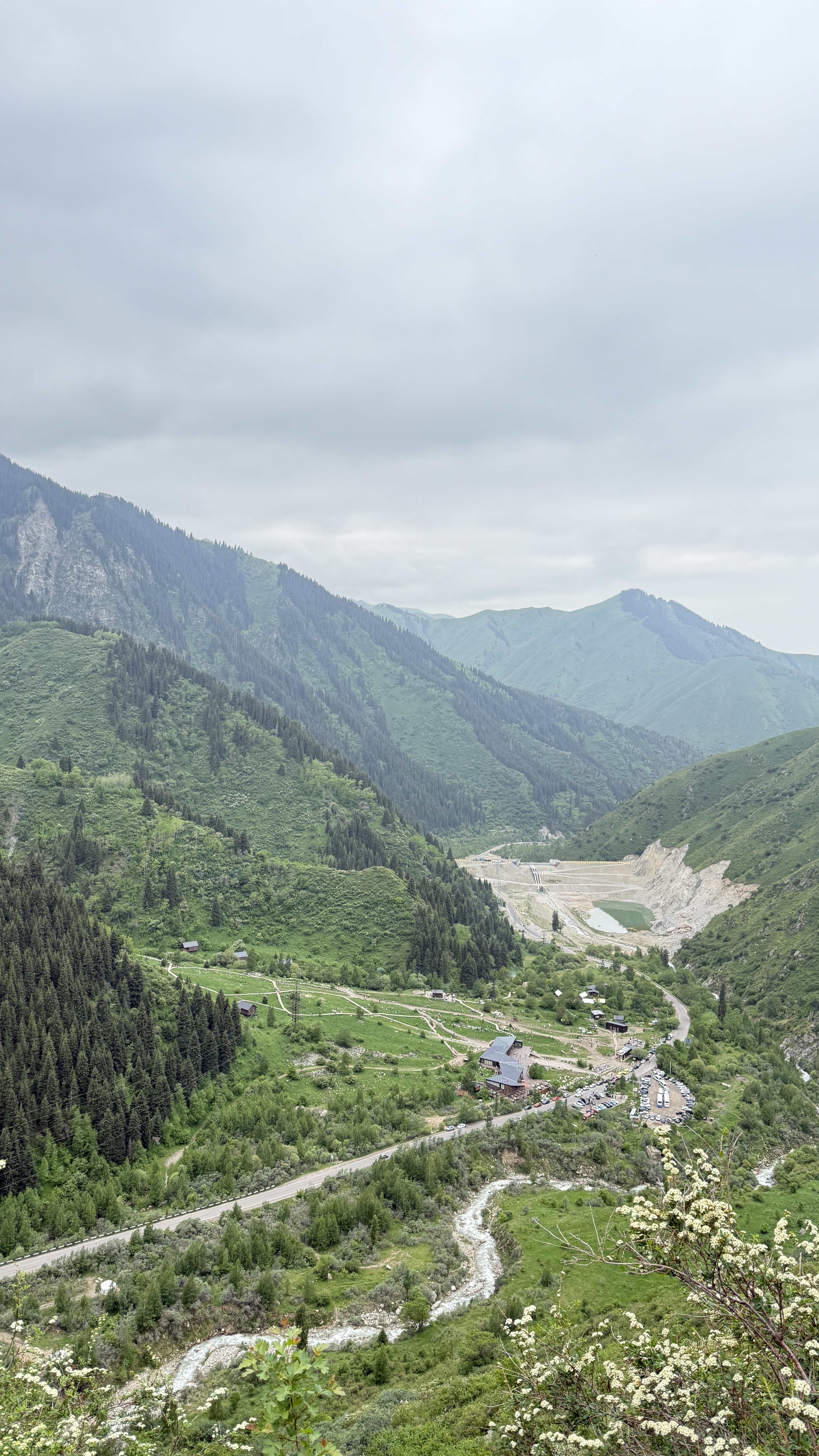 Green mountain valley and river seen from the Japanese Road above Almaty