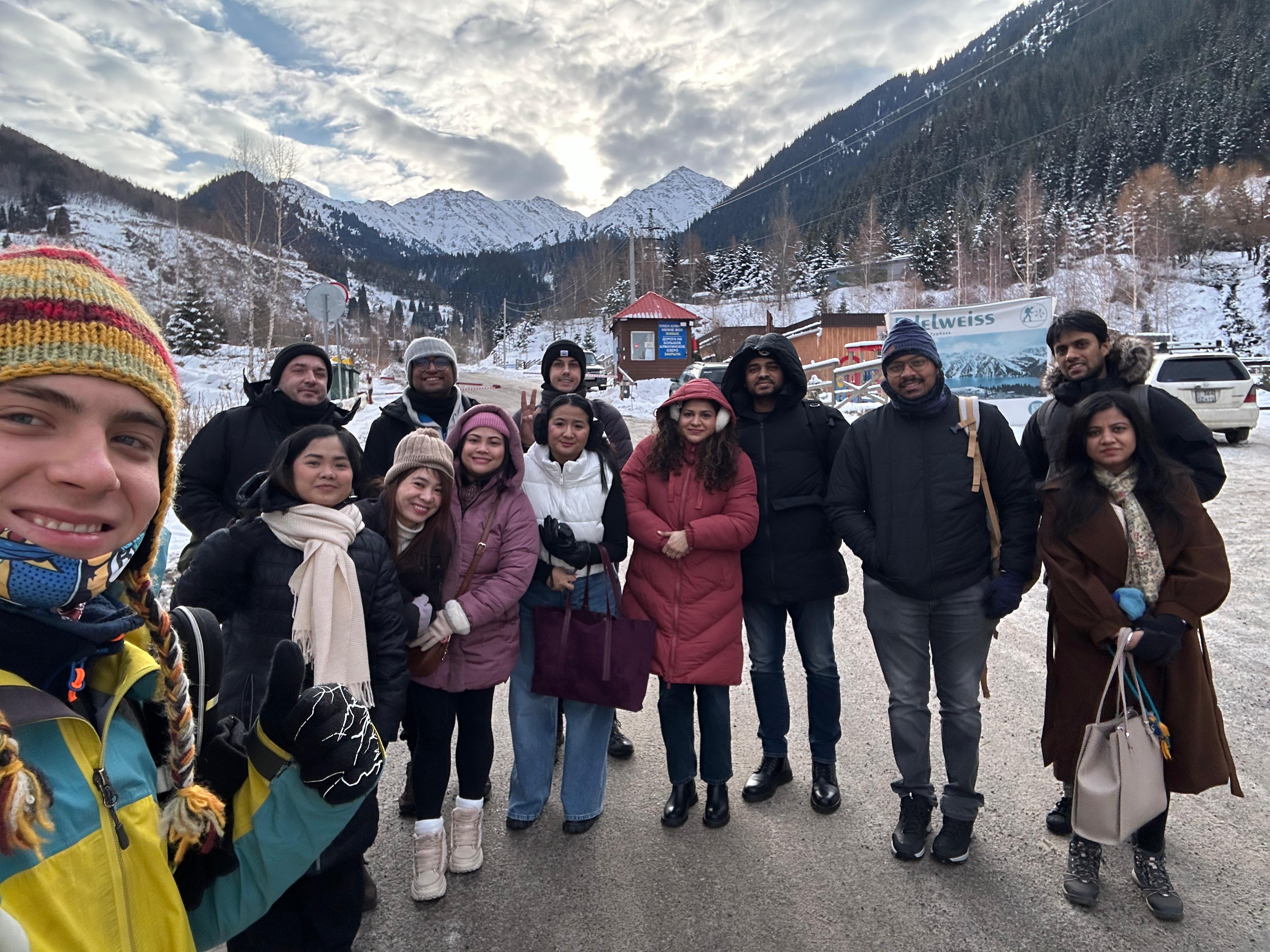 A large group with their Sky Sen guide in the snowy Almaty mountains