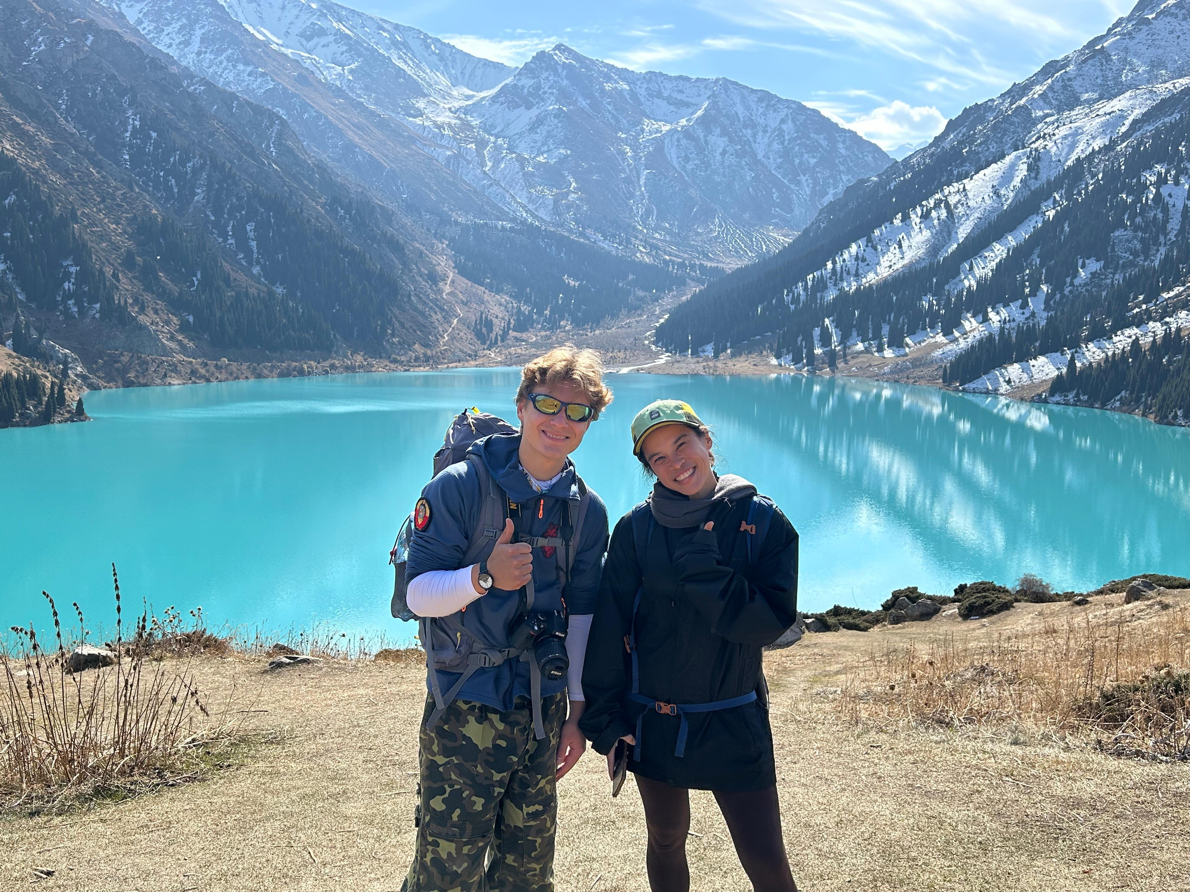 Two travellers with their guide at Big Almaty Lake